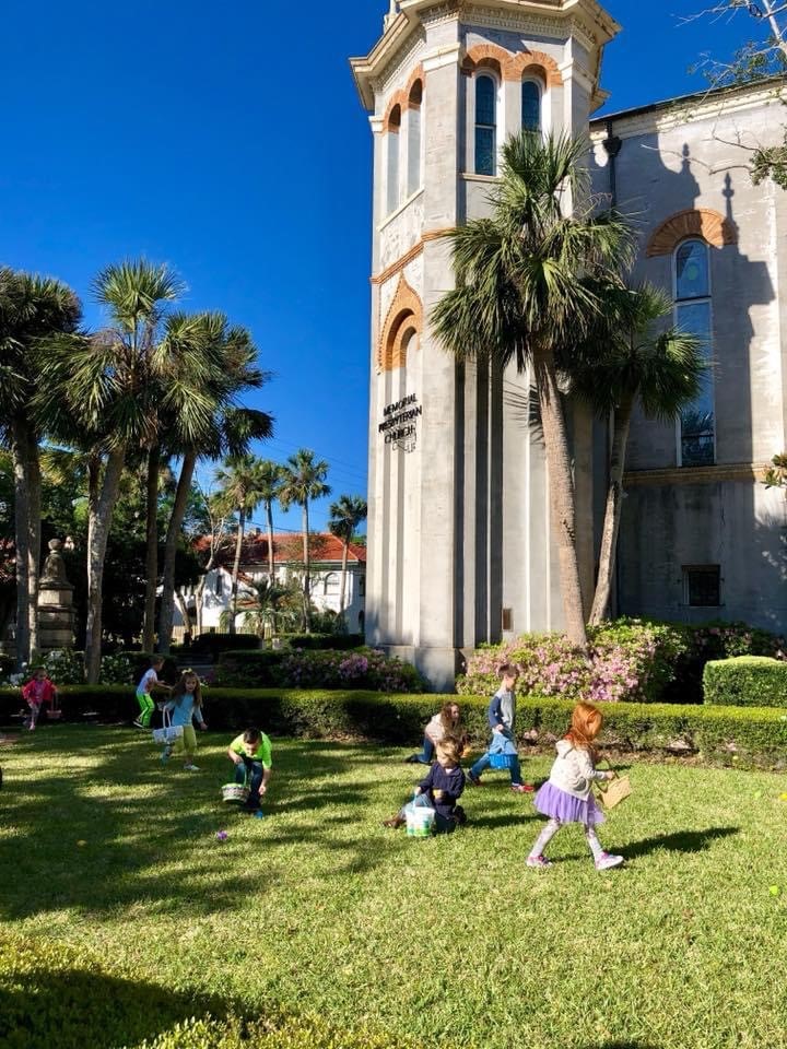 sanctuary grounds with children hunting for eggs