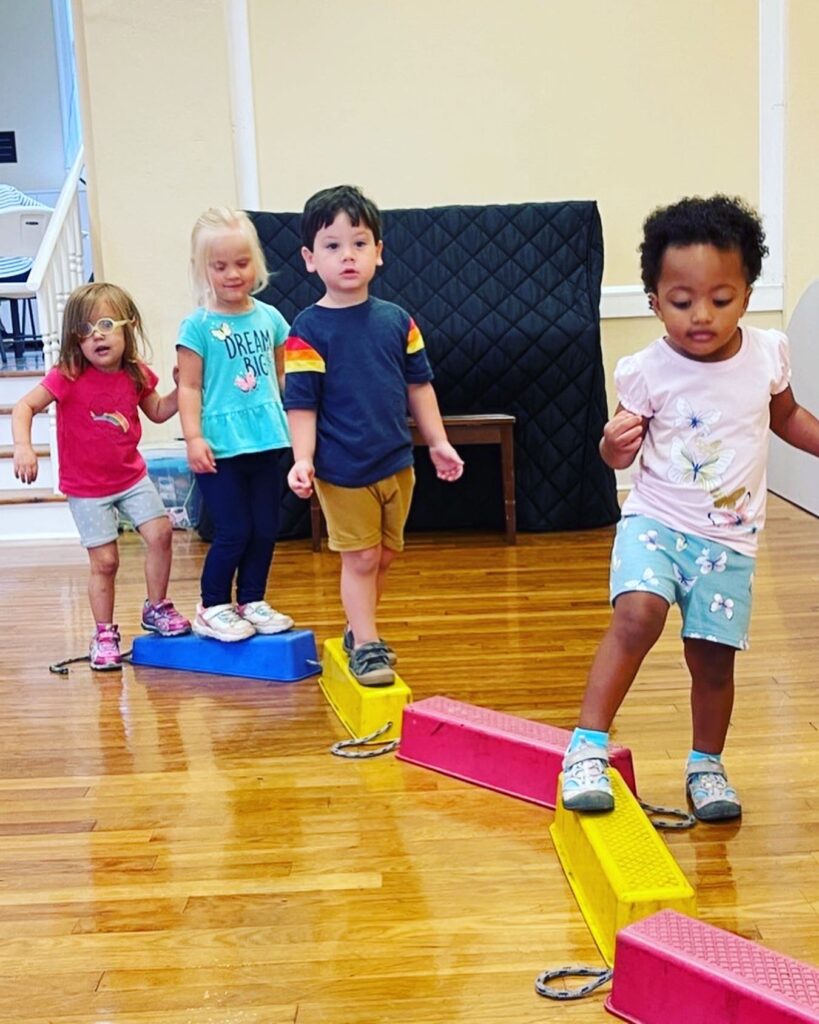 STEAM movement little children on a balance beam