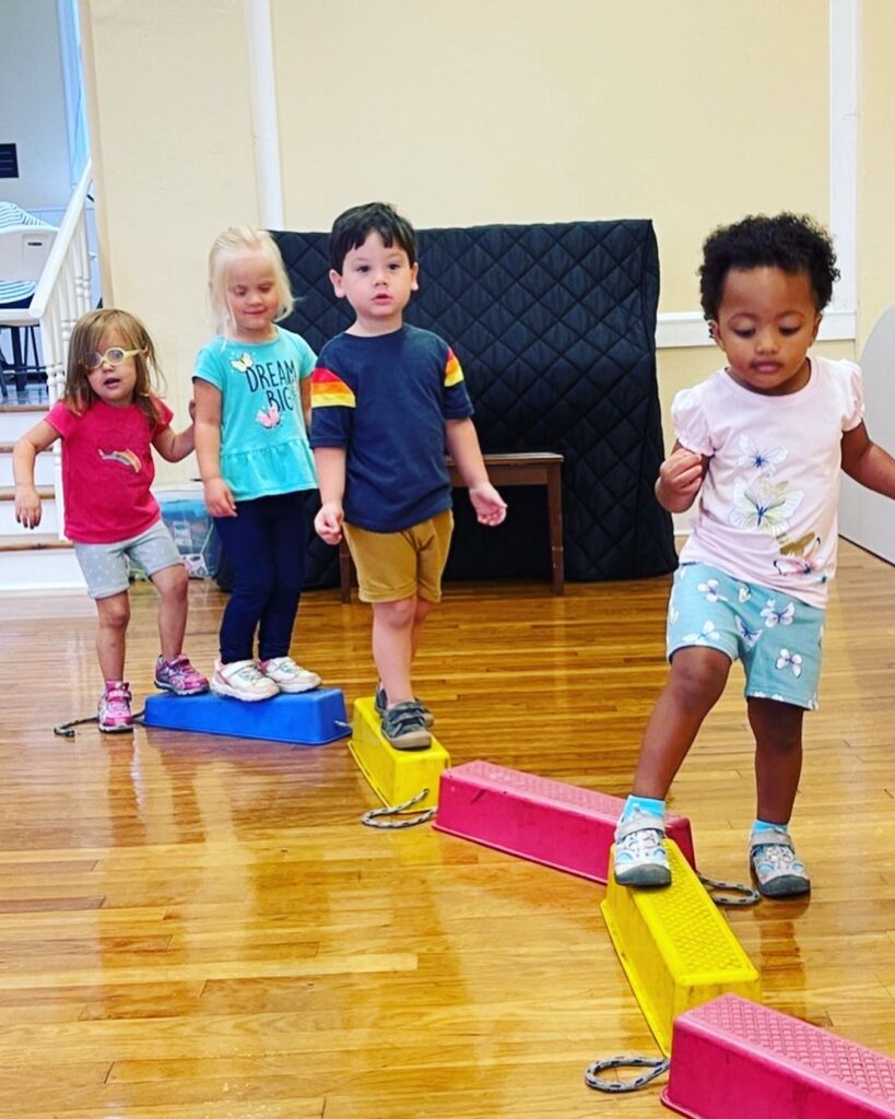 little children on a balance beam