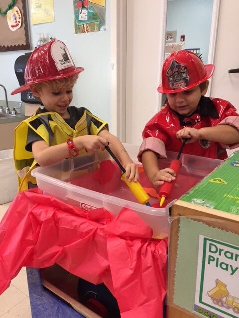 boys playing firefighter