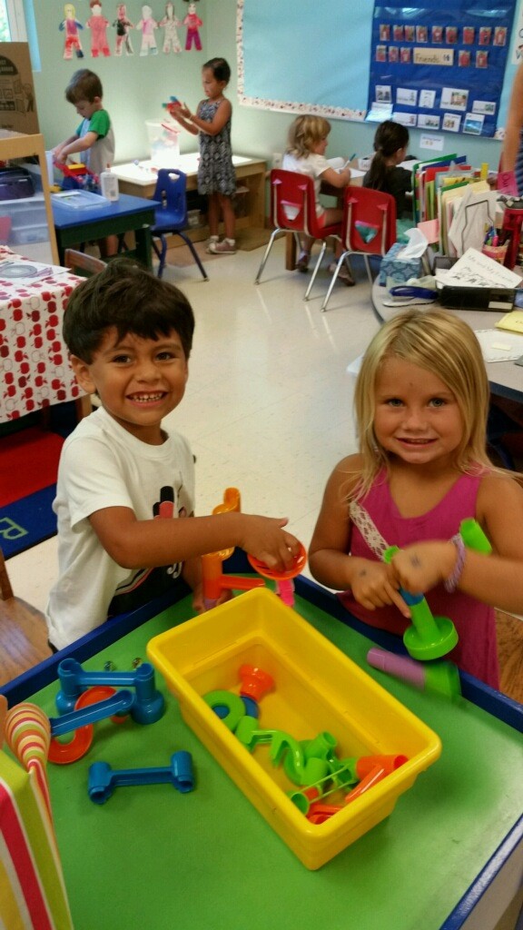 children playing with manipulatives