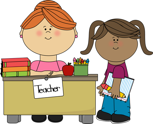 little girl at teacher's desk